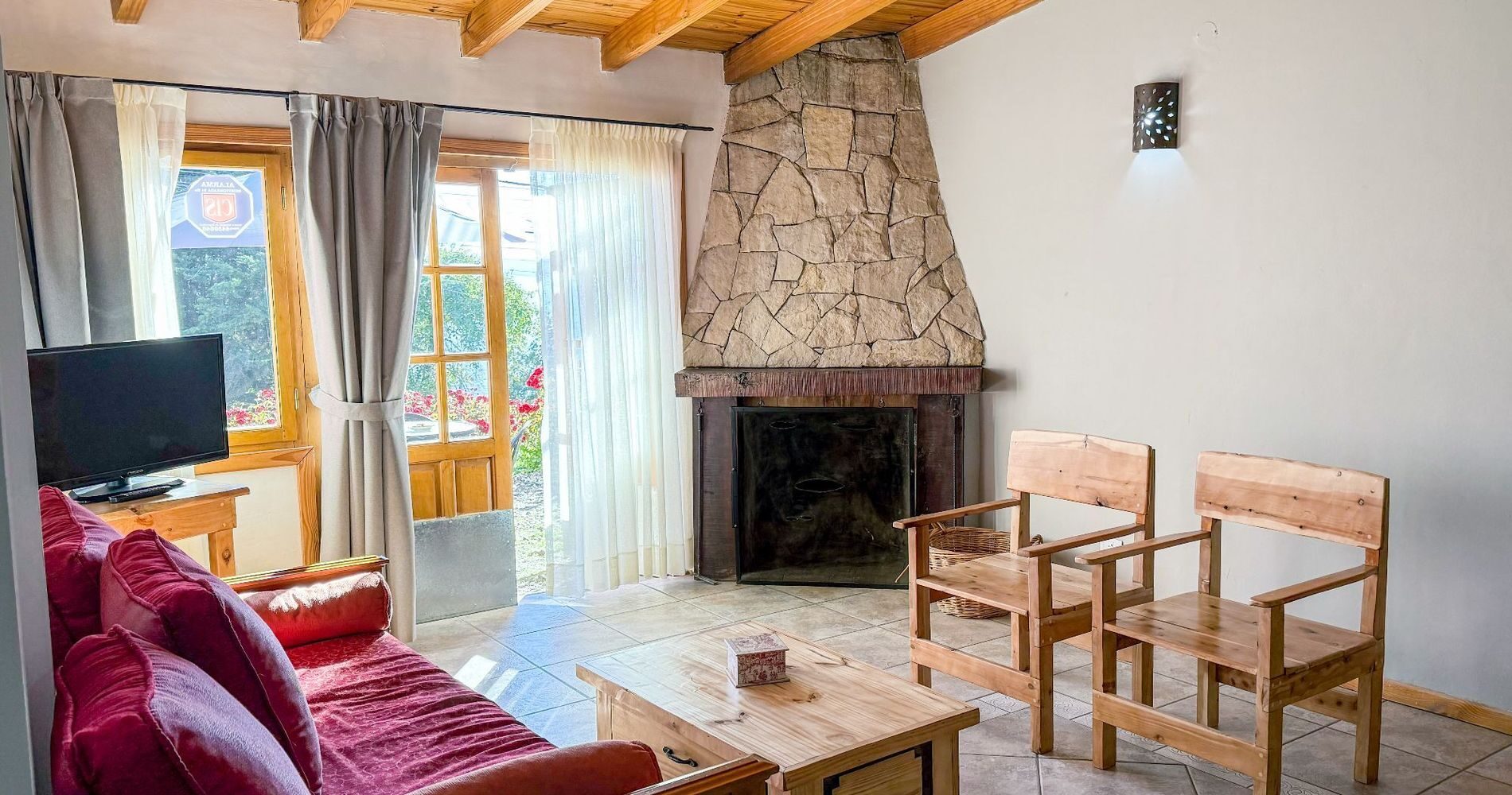 Living room with a wood-burning fireplace